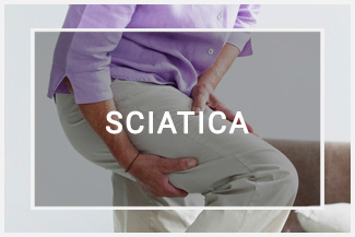 woman holding leg pain sciatica